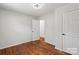 Cozy bedroom featuring hardwood floors and a closet at 2515 Danforth Ln, Charlotte, NC 28208
