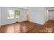 Bright living room featuring a large window with hardwood floors at 2515 Danforth Ln, Charlotte, NC 28208