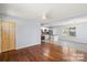 Spacious living area with hardwood floors and a kitchen with modern appliances for comfortable living at 2515 Danforth Ln, Charlotte, NC 28208