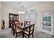 Elegant dining room with a large table, hutch, and natural light at 2620 Yarrow Rd, Charlotte, NC 28213