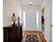Inviting foyer with hardwood floors, decorative rug, and elegant lighting at 2620 Yarrow Rd, Charlotte, NC 28213
