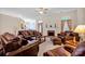 Bright living room featuring a fireplace, ample seating, and a ceiling fan at 2620 Yarrow Rd, Charlotte, NC 28213