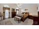 Comfortable main bedroom features a vaulted ceiling, decorative accents, and natural light from the arched windows at 2620 Yarrow Rd, Charlotte, NC 28213