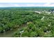 Expansive aerial view of the home and community with nearby lake at 3310 Windbluff Dr, Charlotte, NC 28277
