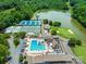 Scenic aerial view of the community pool, tennis courts, and golf course at 3310 Windbluff Dr, Charlotte, NC 28277