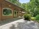 Inviting back patio with flagstone and lush surroundings offers a serene outdoor space at 3310 Windbluff Dr, Charlotte, NC 28277