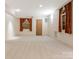 Spacious basement room with two windows and neutral walls, perfect for flexible living at 3310 Windbluff Dr, Charlotte, NC 28277