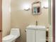 Bathroom with a toilet and sink with a white cabinet at 3310 Windbluff Dr, Charlotte, NC 28277