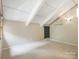 Bedroom featuring unique ceiling design, carpeted flooring, and natural light at 3310 Windbluff Dr, Charlotte, NC 28277