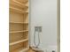 Walk-in closet featuring built-in shelves and plumbing connections at 3310 Windbluff Dr, Charlotte, NC 28277