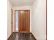 Bright foyer featuring tile floors, stained wood door and side window at 3310 Windbluff Dr, Charlotte, NC 28277