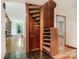 Bright foyer featuring wood floors, wood staircase and stone fireplace at 3310 Windbluff Dr, Charlotte, NC 28277