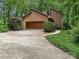 Charming home featuring a spacious garage and beautifully landscaped front yard at 3310 Windbluff Dr, Charlotte, NC 28277