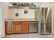Kitchen area featuring wood cabinets, stainless steel appliances, and granite countertops at 3310 Windbluff Dr, Charlotte, NC 28277