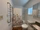 Bright bathroom featuring a floral shower curtain, heated towel rack, and modern vanity with light wood-look floor at 333 Mount View Ln # 266 B, New London, NC 28127
