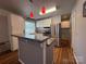 Modern kitchen featuring white cabinets, stainless steel appliances, and a stylish kitchen island with granite countertops at 333 Mount View Ln # 266 B, New London, NC 28127