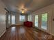 Bright living room with hardwood floors, double doors leading to a deck, and a comfortable seating area at 333 Mount View Ln # 266 B, New London, NC 28127