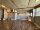 Open living room area featuring wood-look flooring, neutral paint, and built-in storage solutions at 333 Mount View Ln # 266 B, New London, NC 28127