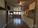 Open living room area featuring wood-look flooring, neutral paint, and lots of windows for natural light at 333 Mount View Ln # 266 B, New London, NC 28127