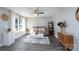 Bright living room with modern decor, wood flooring, a comfortable sofa, and a large window with natural light at 360 Sexton St, Kannapolis, NC 28081