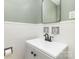 Classic bathroom featuring a white vanity, black faucet and tiled wall at 3969 Sheffield Dr, Charlotte, NC 28205