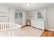 Bright bedroom with light walls, neutral carpet, curtains and furniture at 3969 Sheffield Dr, Charlotte, NC 28205