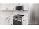 Well-equipped kitchen with stainless steel appliances, sleek countertops and ample storage at 3969 Sheffield Dr, Charlotte, NC 28205