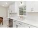 Modern kitchen featuring quartz countertops, black hardware, and stainless steel appliances at 3969 Sheffield Dr, Charlotte, NC 28205