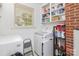 Functional laundry room featuring modern washer/dryer, shelving and plenty of storage at 3969 Sheffield Dr, Charlotte, NC 28205