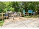 Neighborhood park featuring a wooden walking bridge and nature trail signs at 3969 Sheffield Dr, Charlotte, NC 28205