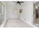 Bright sunroom with neutral walls, ample windows, and tiled floor next to kitchen at 3969 Sheffield Dr, Charlotte, NC 28205