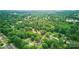 An aerial view of a lush neighborhood with mature trees, offering privacy at 407 Cummings St, Rock Hill, SC 29730