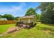 Backyard with a small wood deck, green grass, and a wood fence at 407 Cummings St, Rock Hill, SC 29730