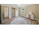 Cozy bedroom showcasing natural light, modern flooring, neutral walls, and ample closet space at 407 Cummings St, Rock Hill, SC 29730