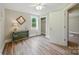 Cozy bedroom featuring light walls, wood floors, a closet, and a window bringing in natural light at 407 Cummings St, Rock Hill, SC 29730