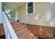 Exterior steps with brown painted base leading up to the front door and porch at 407 Cummings St, Rock Hill, SC 29730