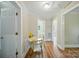 Hallway with wood-look floors, and doorways leading to different rooms at 407 Cummings St, Rock Hill, SC 29730