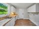 Kitchenette with white cabinets, butcher block counters, sink, and natural light at 407 Cummings St, Rock Hill, SC 29730