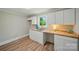 Bright kitchenette featuring white cabinets, butcher block countertops, and natural lighting at 407 Cummings St, Rock Hill, SC 29730