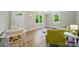Bright living room featuring hardwood floors, large windows, and fresh paint with a white front door at 407 Cummings St, Rock Hill, SC 29730