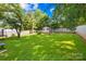 Spacious backyard featuring a shed, green lawn, mature trees and wood fence at 411 Belvedere Cir, Kings Mountain, NC 28086