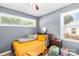 Comfortable bedroom with natural light and yellow accents at 411 Belvedere Cir, Kings Mountain, NC 28086