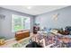 Bright bedroom with a large window, light grey walls, and kid-friendly decor at 411 Belvedere Cir, Kings Mountain, NC 28086