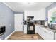 Kitchen featuring white cabinets, granite countertops, new appliances, and wood flooring at 411 Belvedere Cir, Kings Mountain, NC 28086