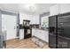 Bright kitchen with modern appliances, white cabinets, updated countertops and wood floors at 411 Belvedere Cir, Kings Mountain, NC 28086