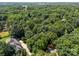 Beautiful aerial view of the home nestled among lush greenery, providing privacy and a serene environment at 4444 Steepleton Way, Charlotte, NC 28215