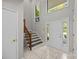 Welcoming foyer with a staircase, tiled floor, and a bright, airy feel at 4444 Steepleton Way, Charlotte, NC 28215