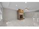 Comfortable living room featuring a brick fireplace and modern ceiling fan at 4444 Steepleton Way, Charlotte, NC 28215