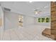 Bright and airy living room featuring tiled floors and backyard views at 4444 Steepleton Way, Charlotte, NC 28215