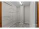 Walk-in closet with wire shelving, providing ample storage space in a neutral color scheme at 4444 Steepleton Way, Charlotte, NC 28215